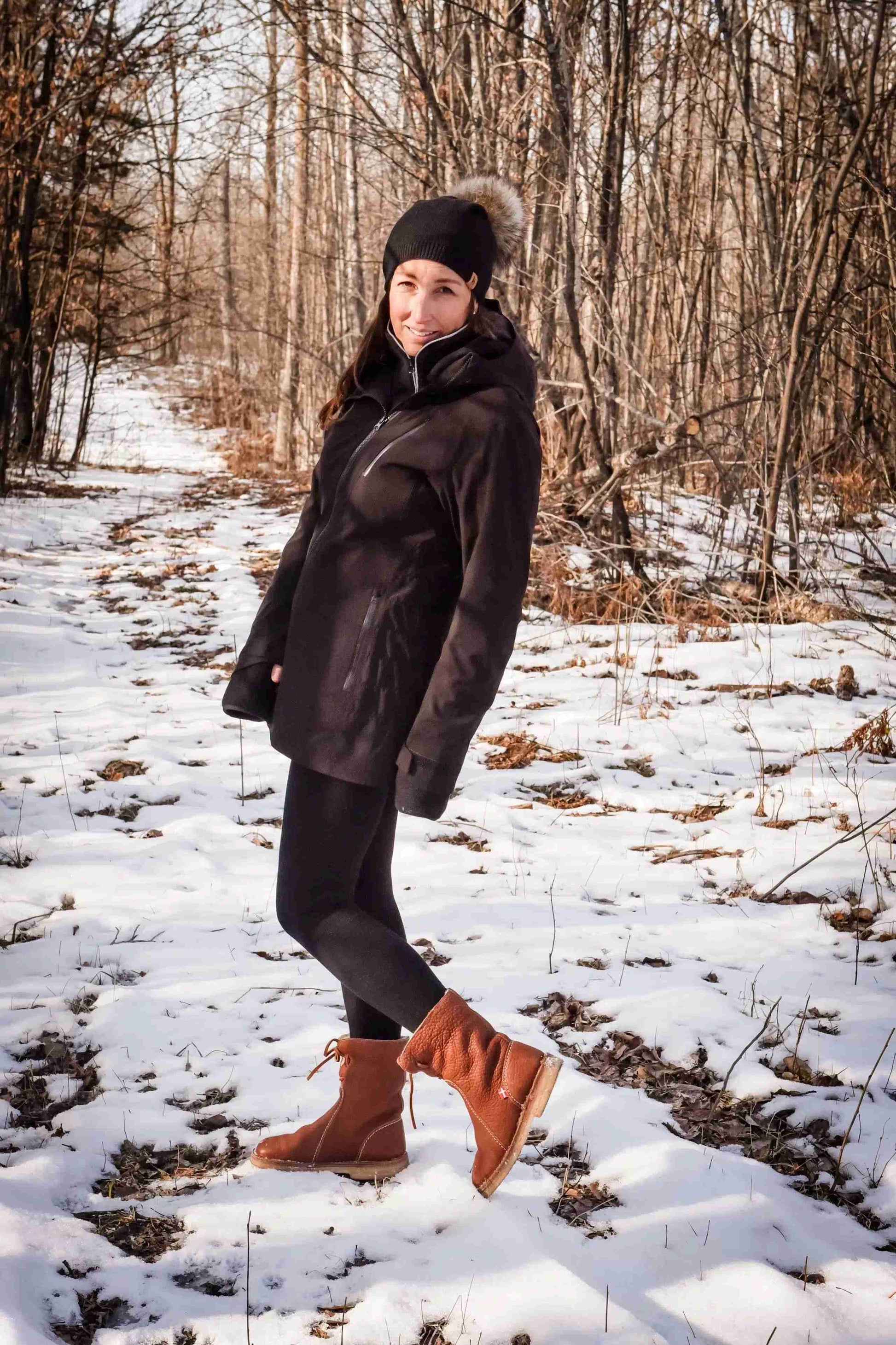 Outdoor lifestyle shot of HEIMmade winter coat in snowy setting