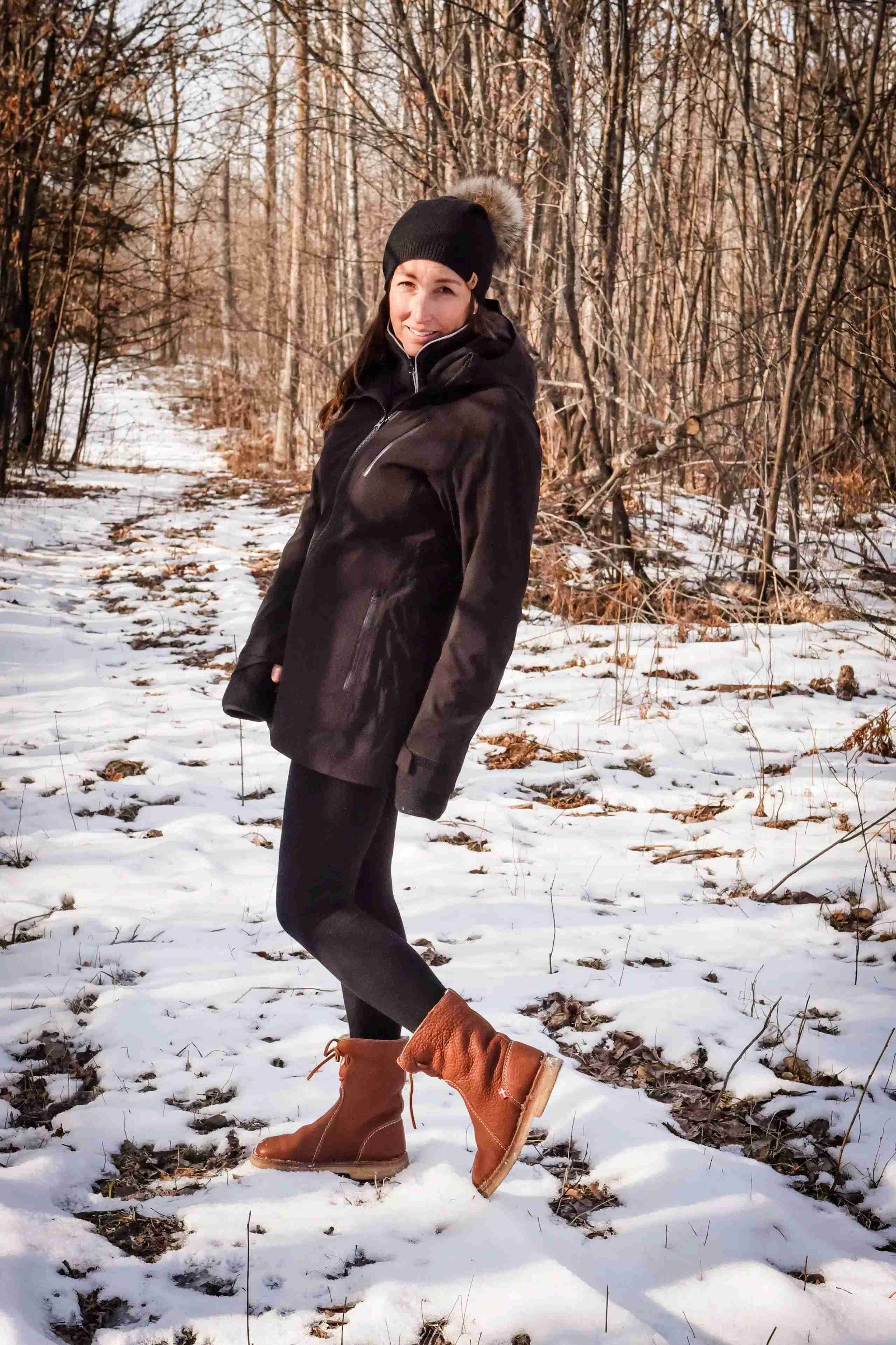 Outdoor lifestyle shot of HEIMmade winter coat in snowy setting